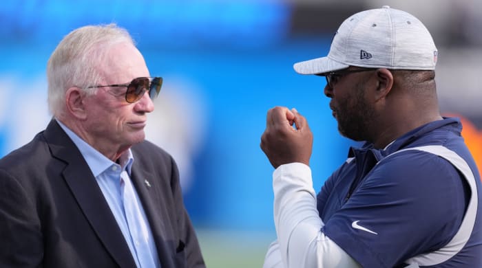 Dallas Cowboys owner Jerry Jones (left) talks with vice president of player personnel Will McClay before a preseason game against the Los Angeles Chargers